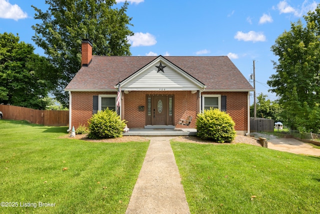 908 Chestnut Ave, Frankfort, KY 40601 - view of front of home with brick siding, a chimney, and roof with shingles