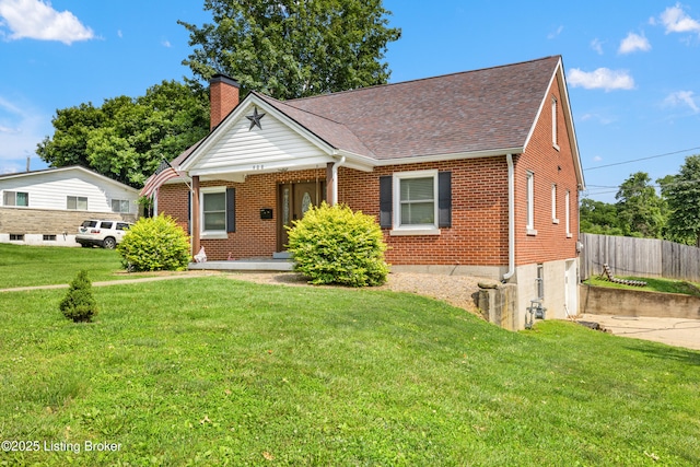 908 Chestnut Ave, Frankfort, KY 40601 - view of front facade featuring brick siding, a chimney, and roof with shingles