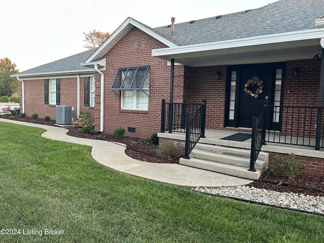 105 Waverly Dr, Bardstown, KY 40004 - property entrance with brick siding, roof with shingles, a yard, and a porch