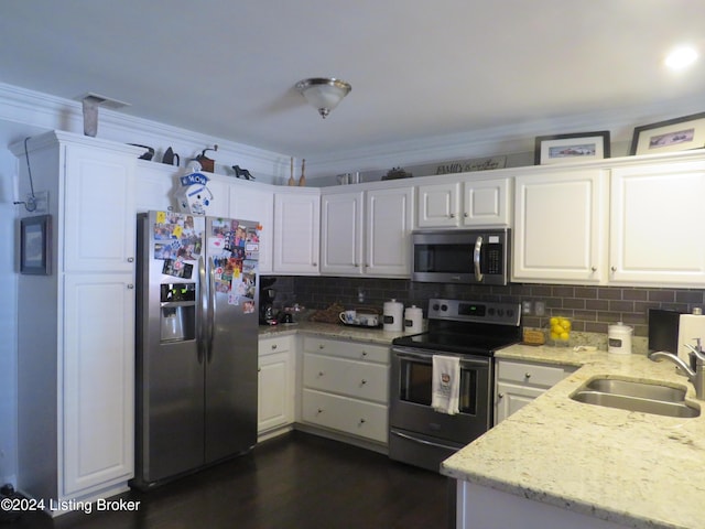 105 Waverly Dr, Bardstown, KY 40004 - kitchen with appliances with stainless steel finishes, white cabinetry, decorative backsplash, and ornamental molding