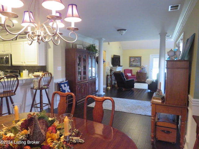 105 Waverly Dr, Bardstown, KY 40004 - dining room with decorative columns, wood finished floors, crown molding, and a chandelier
