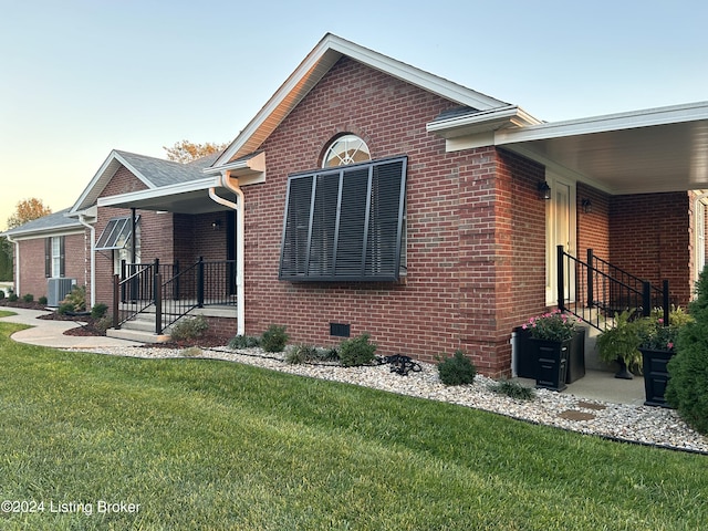 105 Waverly Dr, Bardstown, KY 40004 - view of home's exterior with a porch, a yard, and brick siding