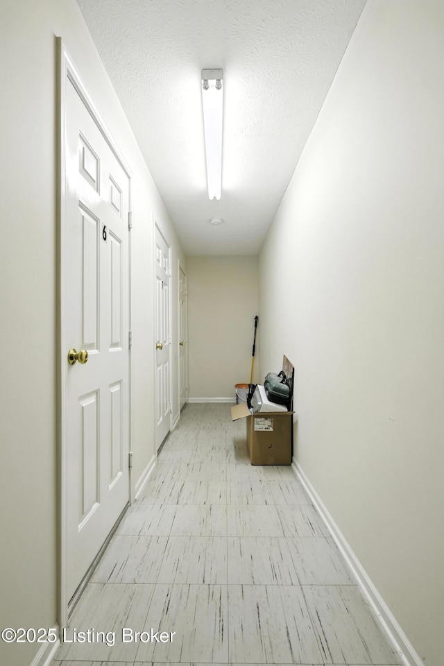 10500 Mcmeekin Ln Unit 208, Louisville, KY 40223 - hallway with tile patterned floors and a textured ceiling