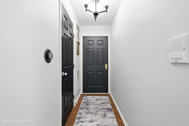 10500 Mcmeekin Ln Unit 208, Louisville, KY 40223 - doorway to outside with dark wood finished floors and baseboards