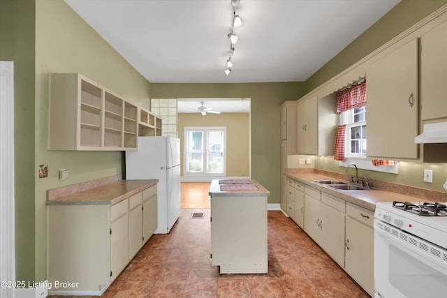 129 N Bellaire Ave, Louisville, KY 40206 - kitchen with white appliances, a center island, ceiling fan, and light countertops