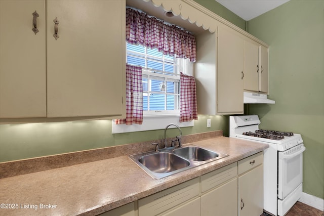 129 N Bellaire Ave, Louisville, KY 40206 - kitchen featuring white range with gas stovetop, exhaust hood, light countertops, and white cabinetry