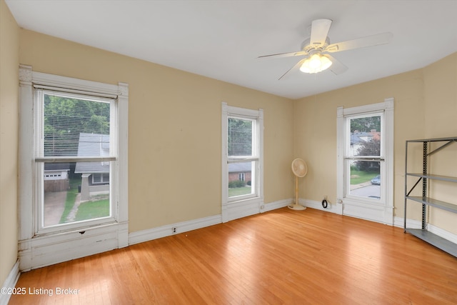 129 N Bellaire Ave, Louisville, KY 40206 - unfurnished room featuring light wood-style floors, plenty of natural light, and ceiling fan