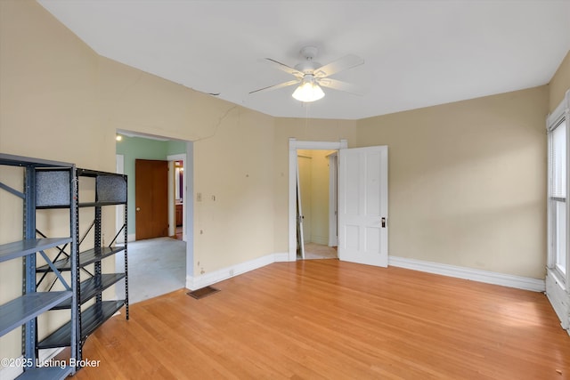 129 N Bellaire Ave, Louisville, KY 40206 - empty room with a ceiling fan and light wood finished floors