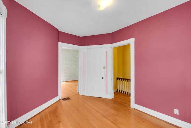 129 N Bellaire Ave, Louisville, KY 40206 - unfurnished bedroom featuring light wood finished floors and baseboards