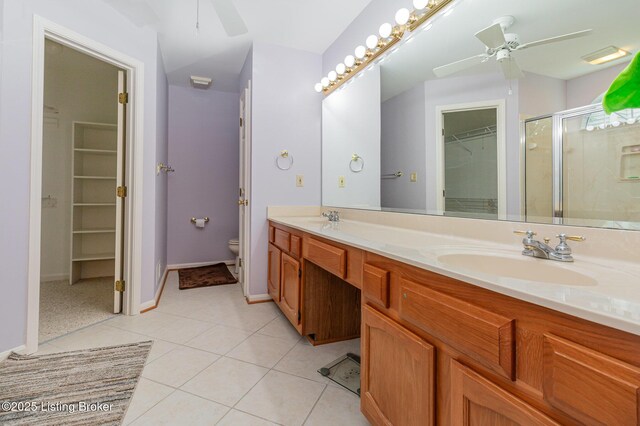 2716 Antone Pkwy, Louisville, KY 40220 - bathroom featuring ceiling fan, double vanity, a spacious closet, tile patterned floors, and a shower stall