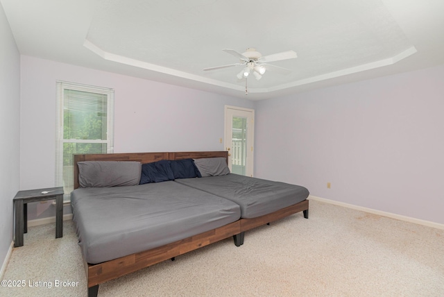 2716 Antone Pkwy, Louisville, KY 40220 - carpeted bedroom with a raised ceiling, multiple windows, and ceiling fan