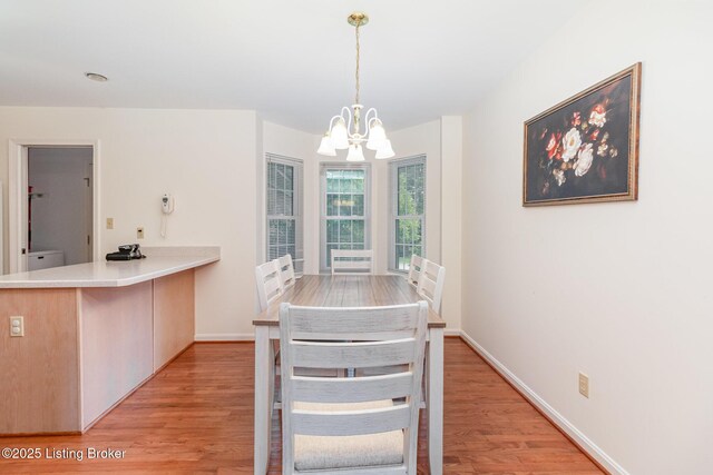 2716 Antone Pkwy, Louisville, KY 40220 - dining area with a chandelier and light wood-style flooring