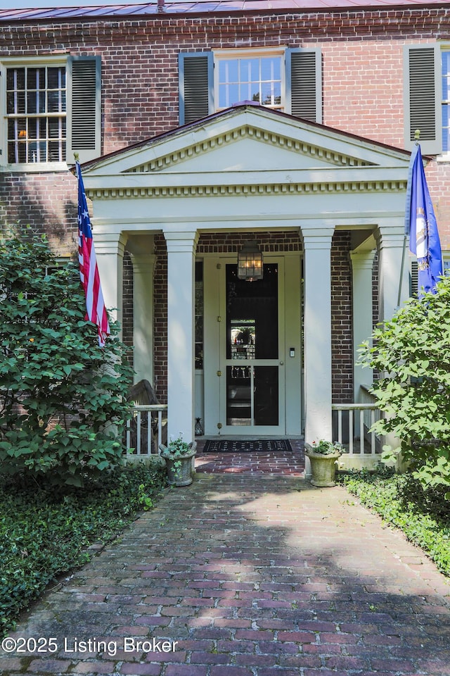 2406 Tucker Station Rd, Louisville, KY 40299 - property entrance with brick siding and a porch