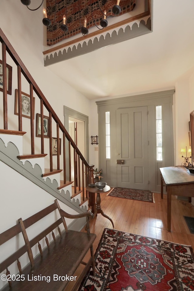 2406 Tucker Station Rd, Louisville, KY 40299 - entrance foyer with hardwood / wood-style flooring, plenty of natural light, and stairs