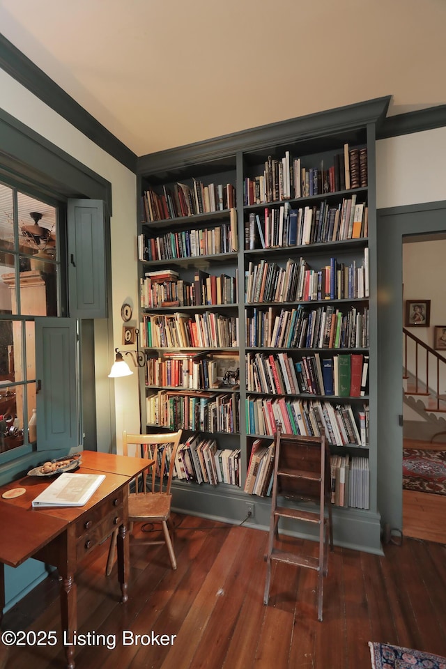 2406 Tucker Station Rd, Louisville, KY 40299 - sitting room with bookshelves and wood-type flooring