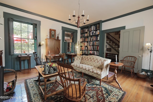 2406 Tucker Station Rd, Louisville, KY 40299 - sitting room featuring hardwood / wood-style floors, stairway, built in shelves, ornamental molding, and a chandelier