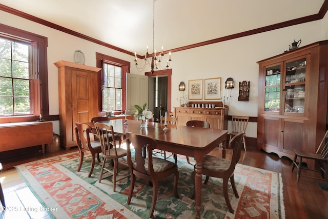 2406 Tucker Station Rd, Louisville, KY 40299 - dining area featuring hardwood / wood-style floors, a chandelier, and crown molding
