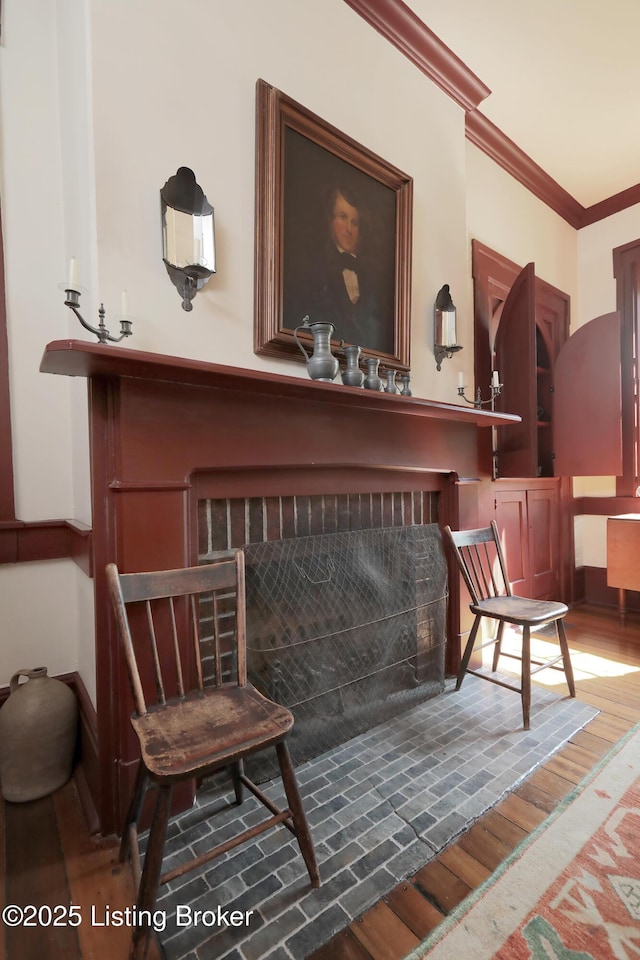 2406 Tucker Station Rd, Louisville, KY 40299 - detailed view of wood finished floors, ornamental molding, and a fireplace with flush hearth