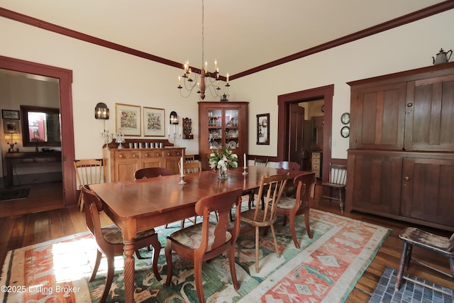 2406 Tucker Station Rd, Louisville, KY 40299 - dining space with hardwood / wood-style flooring, crown molding, and a chandelier