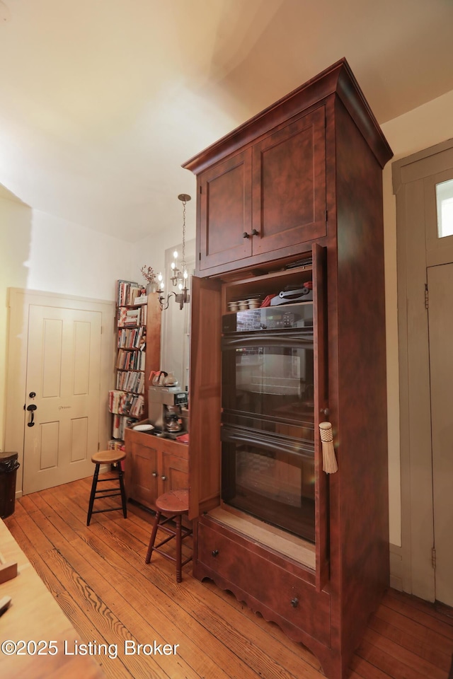 2406 Tucker Station Rd, Louisville, KY 40299 - detailed view of wood finished floors, a chandelier, and a desk