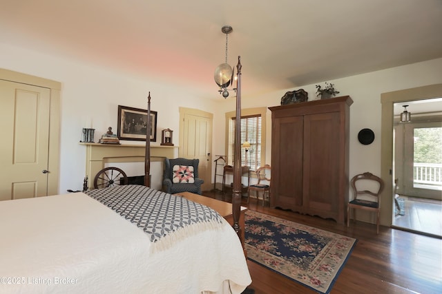 2406 Tucker Station Rd, Louisville, KY 40299 - bedroom featuring wood finished floors and access to exterior
