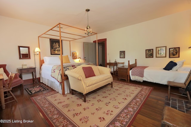 2406 Tucker Station Rd, Louisville, KY 40299 - bedroom featuring a chandelier and hardwood / wood-style floors