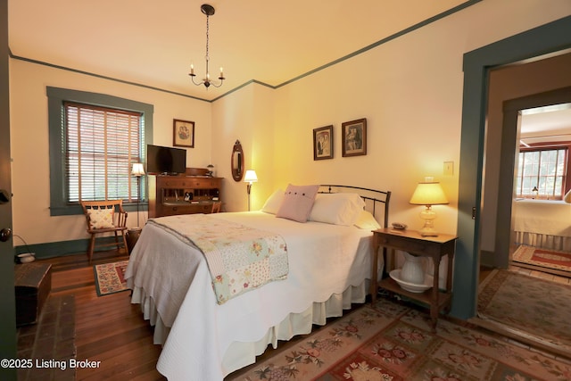 2406 Tucker Station Rd, Louisville, KY 40299 - bedroom with a chandelier and wood finished floors