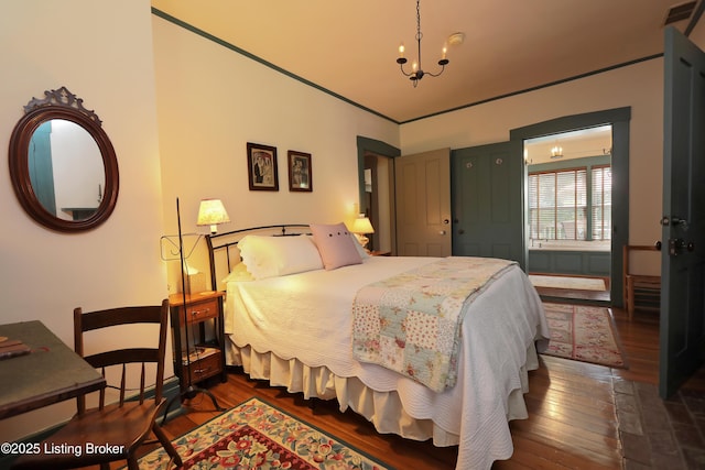 2406 Tucker Station Rd, Louisville, KY 40299 - bedroom featuring a chandelier and hardwood / wood-style floors