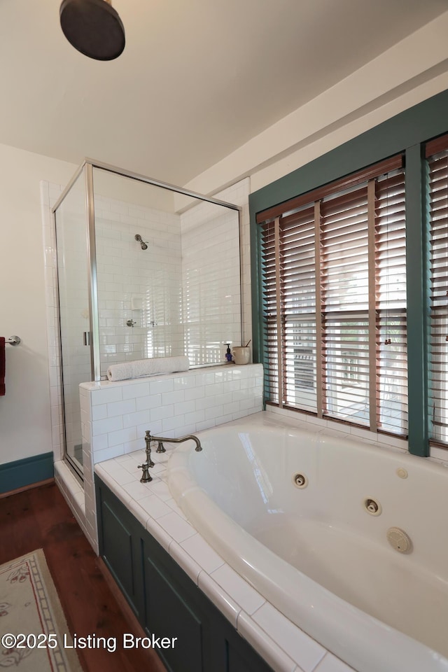 2406 Tucker Station Rd, Louisville, KY 40299 - bathroom featuring a tub with jets, a shower stall, and wood finished floors