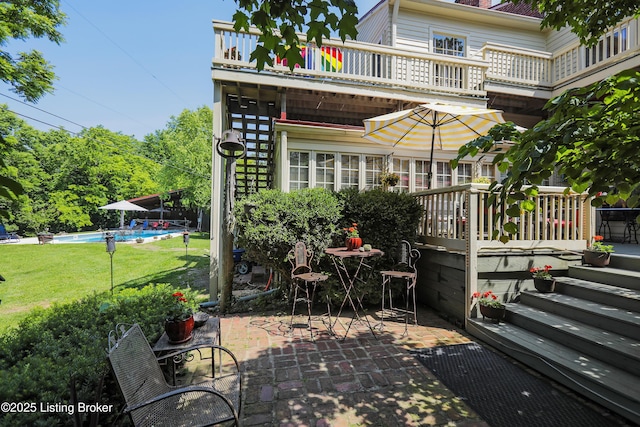 2406 Tucker Station Rd, Louisville, KY 40299 - patio / terrace with a patio, an outdoor pool, and a lawn