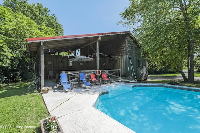 2406 Tucker Station Rd, Louisville, KY 40299 - swimming pool featuring a patio and a lawn