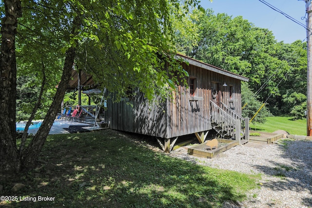 2406 Tucker Station Rd, Louisville, KY 40299 - view of home's exterior with a lawn and a pool