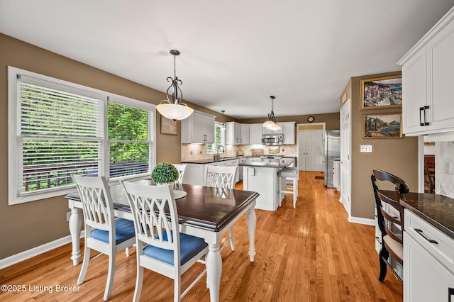 4423 Grand Cir, Crestwood, KY 40014 - dining room with light wood-type flooring and baseboards