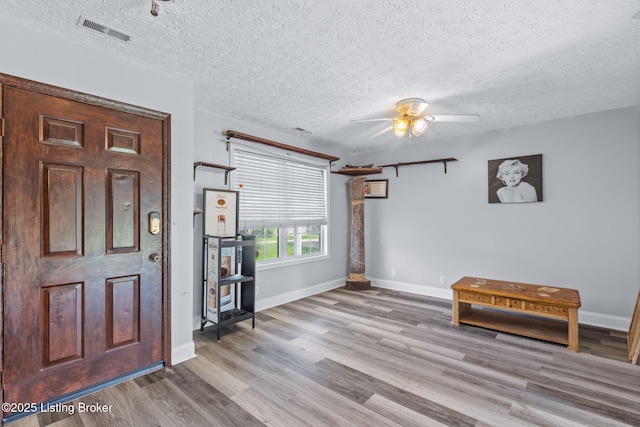 128 Clover Cove Ct, Shepherdsville, KY 40165 - foyer entrance with a ceiling fan, wood finished floors, and a textured ceiling