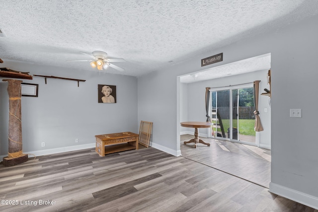 128 Clover Cove Ct, Shepherdsville, KY 40165 - unfurnished room featuring wood finished floors, a ceiling fan, and a textured ceiling