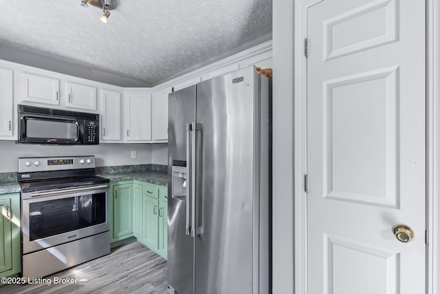 128 Clover Cove Ct, Shepherdsville, KY 40165 - kitchen featuring stainless steel appliances, a textured ceiling, green cabinets, light wood-style floors, and white cabinets