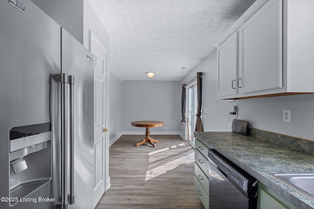 128 Clover Cove Ct, Shepherdsville, KY 40165 - kitchen with freestanding refrigerator, dishwasher, wood finished floors, a textured ceiling, and dark countertops