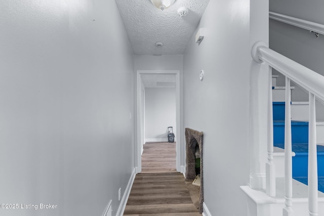 128 Clover Cove Ct, Shepherdsville, KY 40165 - stairway featuring a textured ceiling and wood finished floors