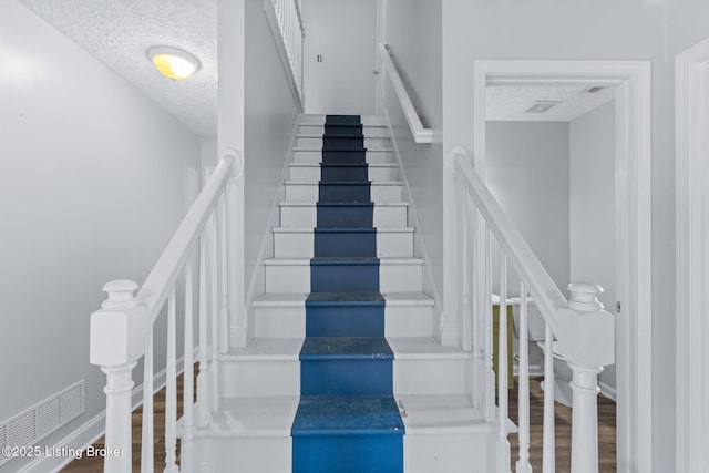 128 Clover Cove Ct, Shepherdsville, KY 40165 - stairs with a textured ceiling and wood finished floors