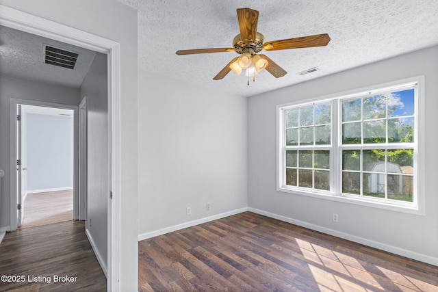 128 Clover Cove Ct, Shepherdsville, KY 40165 - spare room with a textured ceiling, dark wood-type flooring, and ceiling fan