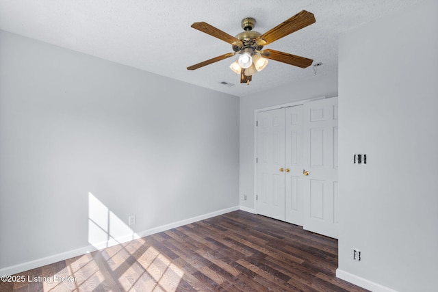 128 Clover Cove Ct, Shepherdsville, KY 40165 - unfurnished bedroom featuring dark wood-style floors, a closet, ceiling fan, and a textured ceiling
