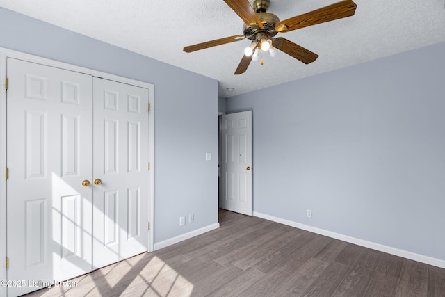 128 Clover Cove Ct, Shepherdsville, KY 40165 - unfurnished bedroom with wood finished floors, a closet, a textured ceiling, and a ceiling fan