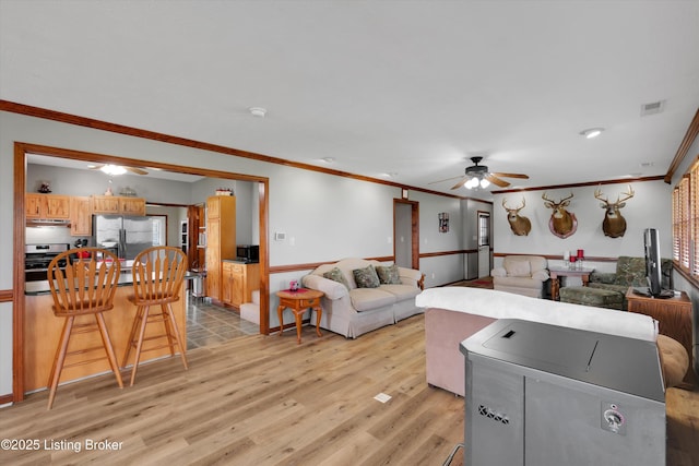 2883 Sweeney Ln, Pleasureville, KY 40057 - living area featuring a ceiling fan, light wood-type flooring, and ornamental molding