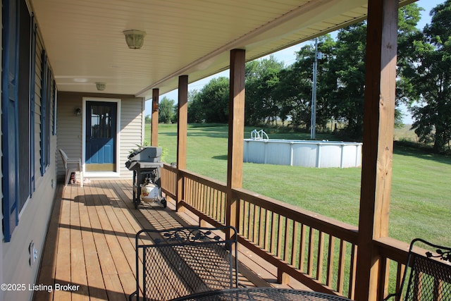 2883 Sweeney Ln, Pleasureville, KY 40057 - wooden terrace featuring a grill, an outdoor pool, and a yard