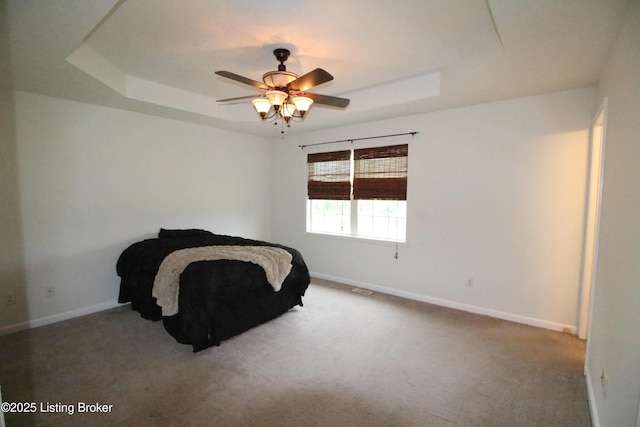 105 Wayne Way, Radcliff, KY 40160 - carpeted bedroom featuring a tray ceiling and ceiling fan