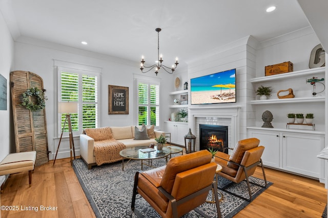 6331 Mistflower Cir, Prospect, KY 40059 - living area featuring light wood finished floors, recessed lighting, built in shelves, a chandelier, and a tile fireplace