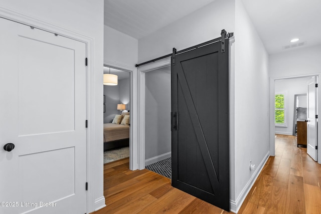 6331 Mistflower Cir, Prospect, KY 40059 - hallway featuring a barn door, light wood-type flooring, and recessed lighting