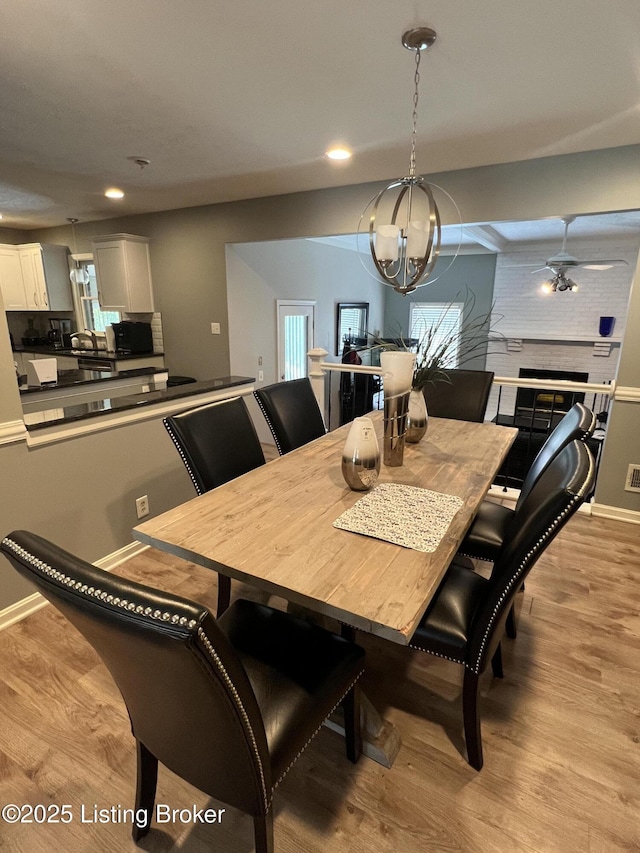 12112 Alpine Way, Goshen, KY 40026 - dining area featuring light wood finished floors, recessed lighting, and a chandelier