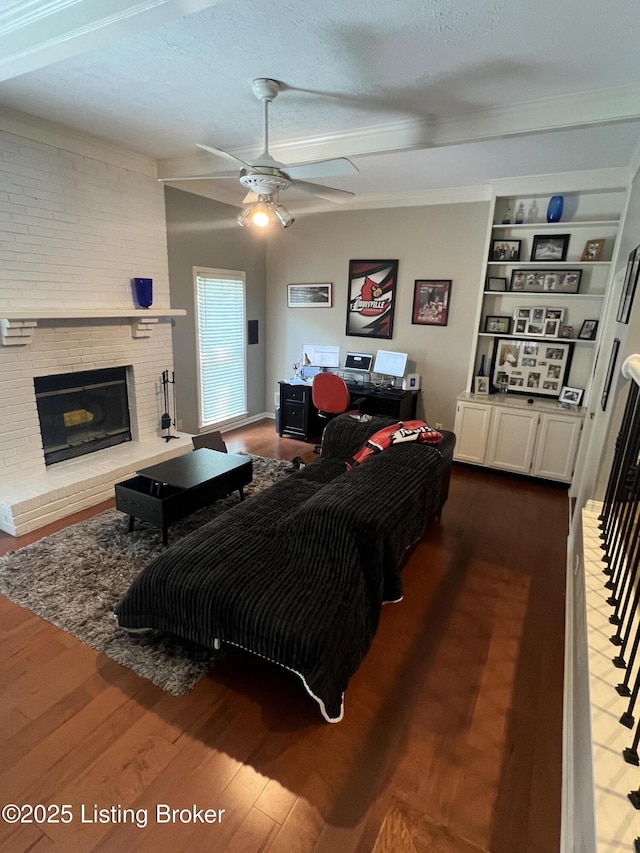 12112 Alpine Way, Goshen, KY 40026 - living area with dark wood-style floors, ceiling fan, a fireplace, a textured ceiling, and ornamental molding