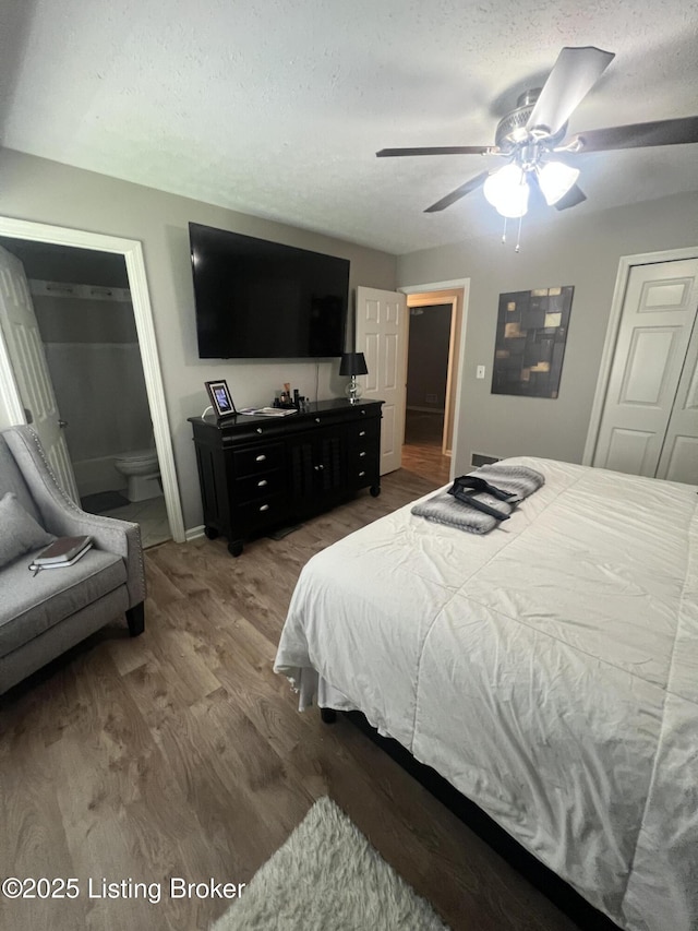 12112 Alpine Way, Goshen, KY 40026 - bedroom featuring wood finished floors, ensuite bathroom, ceiling fan, and a textured ceiling
